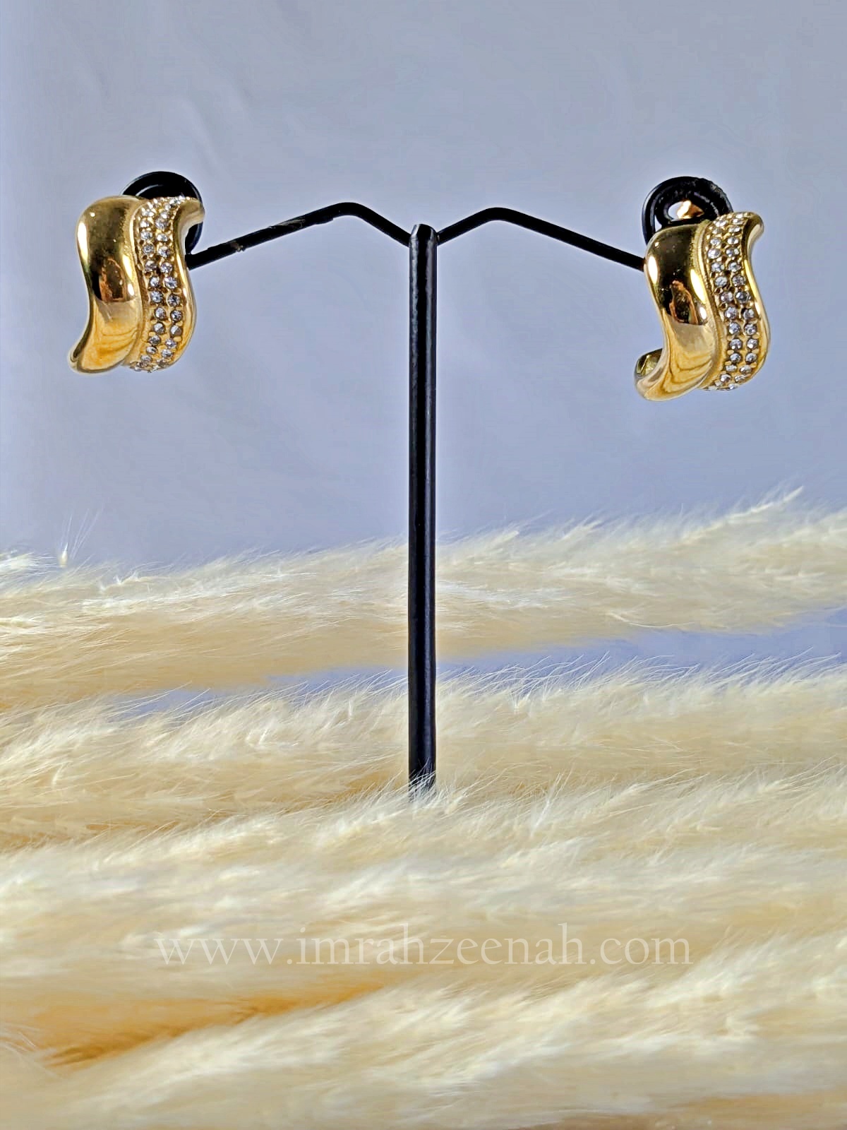 Wave Curve Gold Hoop Earrings with sparkling stones in elegant gold finish.